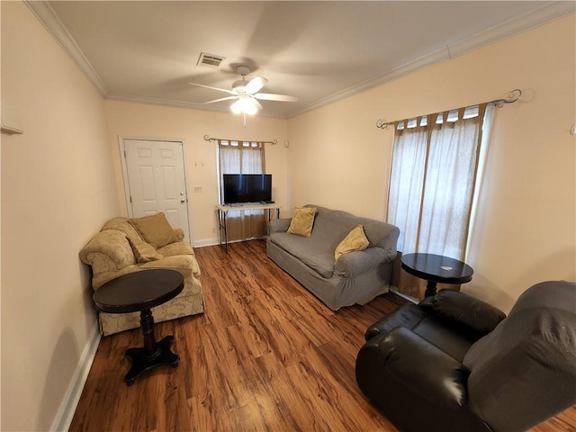 living room with crown molding, ceiling fan, and hardwood / wood-style floors