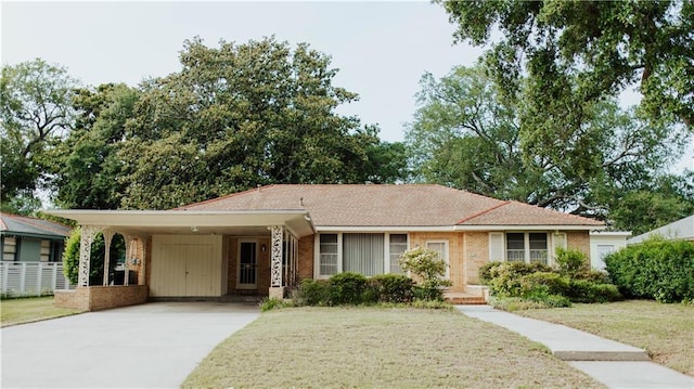 single story home featuring a carport and a front yard