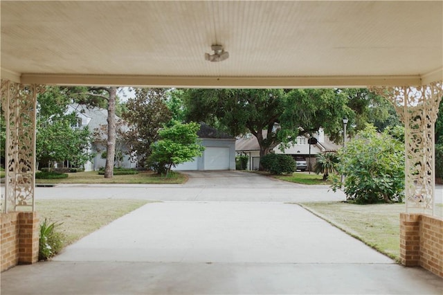 view of patio featuring a garage and an outdoor structure