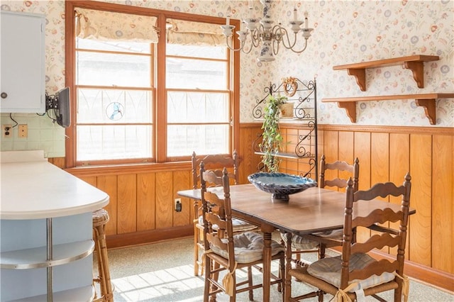 carpeted dining room featuring plenty of natural light