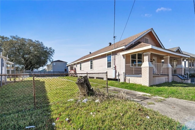 view of side of property with a yard