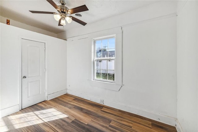 spare room featuring ceiling fan and hardwood / wood-style flooring