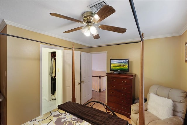 bedroom featuring ornamental molding, ceiling fan, and light hardwood / wood-style floors