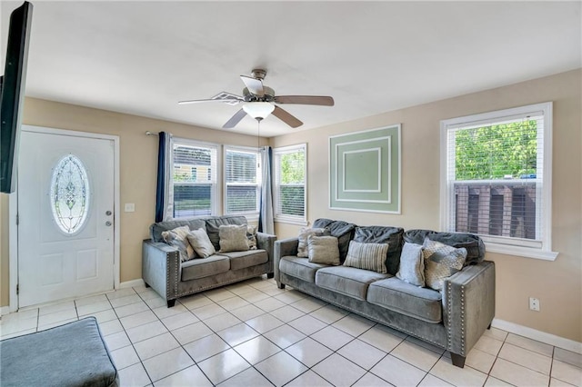 5611 Arts St, New Orleans, LA 70122 - living area featuring baseboards, light tile patterned flooring, and ceiling fan