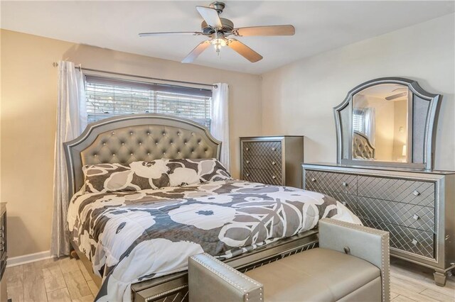 5611 Arts St, New Orleans, LA 70122 - bedroom featuring wood finished floors, baseboards, and a ceiling fan