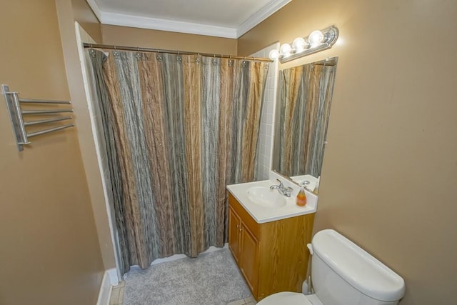 bathroom with vanity, toilet, ornamental molding, and walk in shower