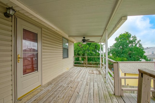 deck with ceiling fan and a porch