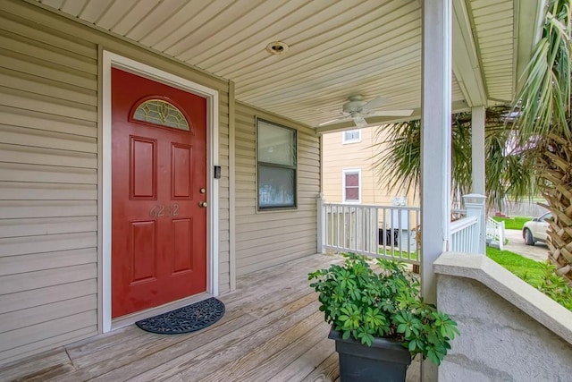 doorway to property with ceiling fan and covered porch