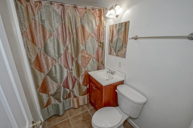 bathroom with tile patterned flooring, a shower with curtain, vanity, and toilet