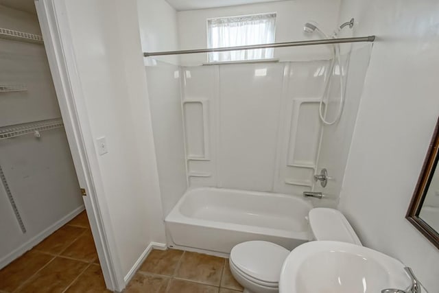 full bathroom with tile patterned floors, sink, shower / washtub combination, and toilet