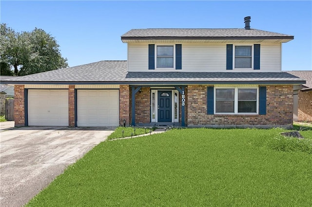 front of property featuring a garage and a front yard