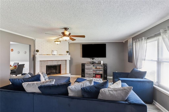 living room featuring crown molding, a textured ceiling, and a fireplace