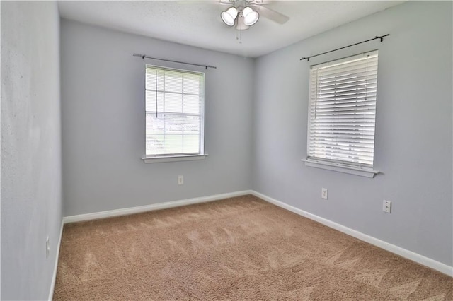 empty room with carpet and ceiling fan