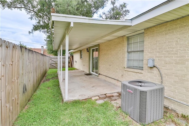 view of yard with a patio area and central AC