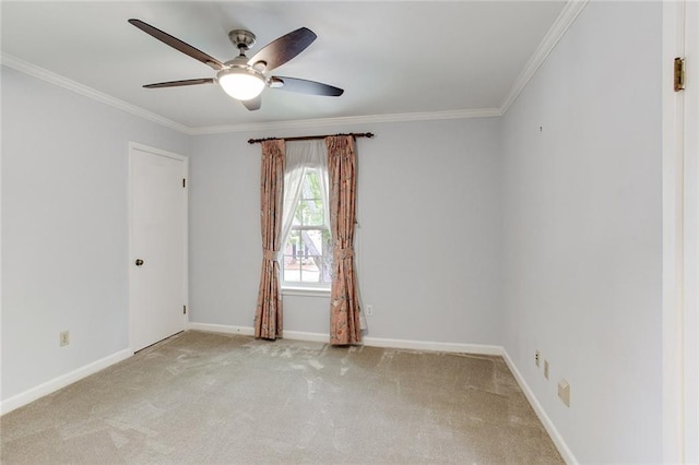 carpeted empty room featuring ornamental molding and ceiling fan