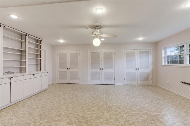 interior space with ceiling fan, french doors, and crown molding