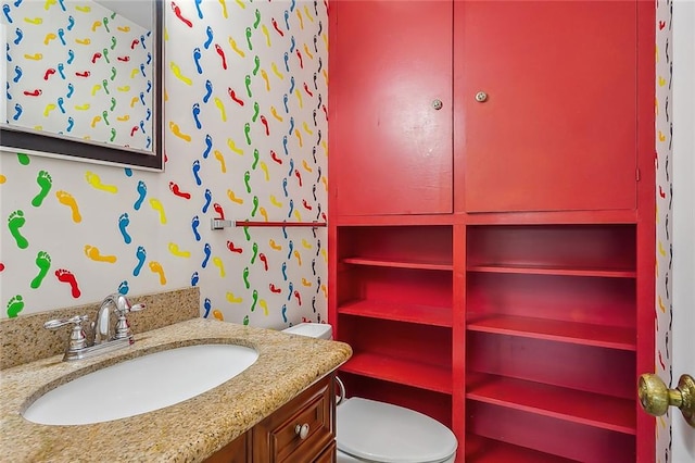 bathroom with vanity and toilet