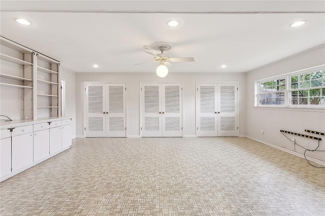 interior space featuring french doors and ceiling fan