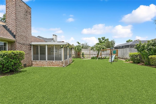 view of yard featuring a sunroom