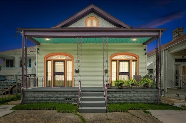 view of front of property featuring covered porch