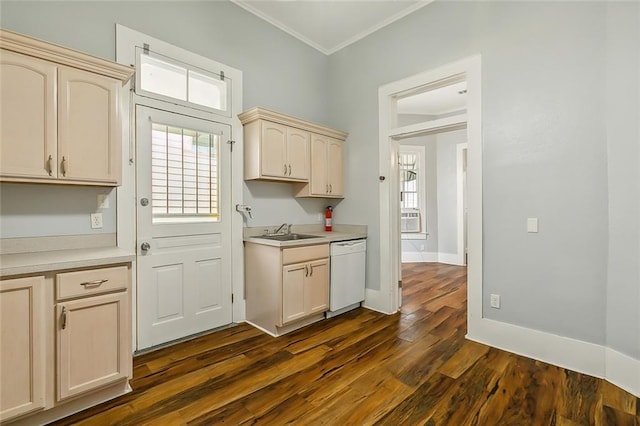 kitchen with a wealth of natural light, ornamental molding, white dishwasher, and light countertops