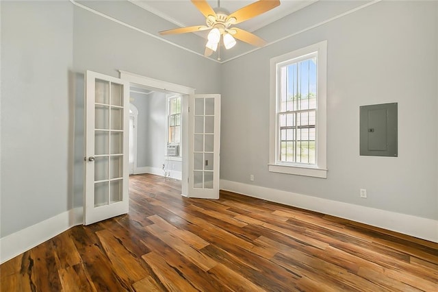 unfurnished room with dark wood-type flooring, a ceiling fan, electric panel, french doors, and baseboards