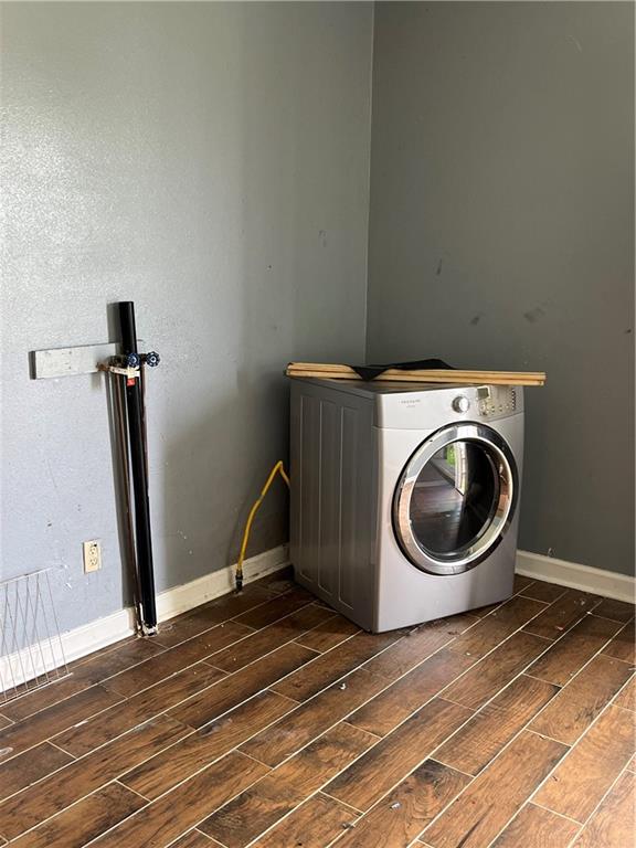 laundry area featuring washer / clothes dryer and dark hardwood / wood-style floors