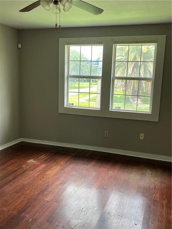 unfurnished room featuring ceiling fan and wood-type flooring