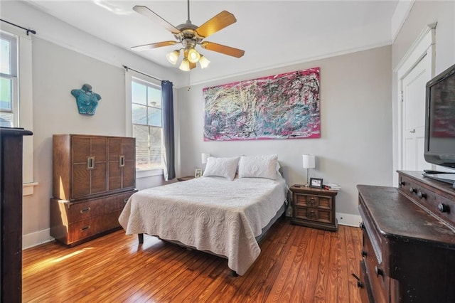 bedroom with hardwood / wood-style flooring and ceiling fan