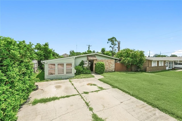 back of house featuring a yard