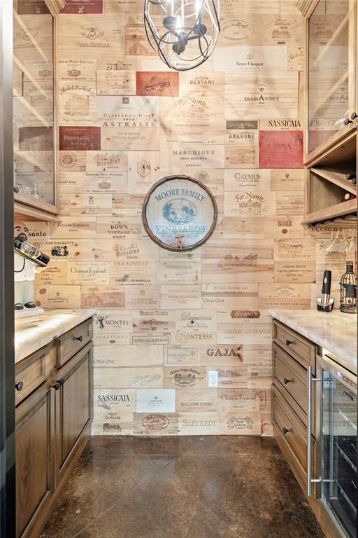 bathroom featuring vanity, beverage cooler, and wooden walls