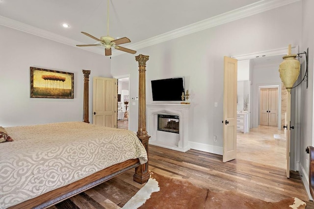 bedroom with ceiling fan, wood-type flooring, and ornamental molding