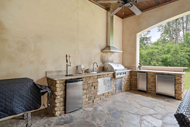 view of patio featuring ceiling fan, a grill, exterior kitchen, and sink