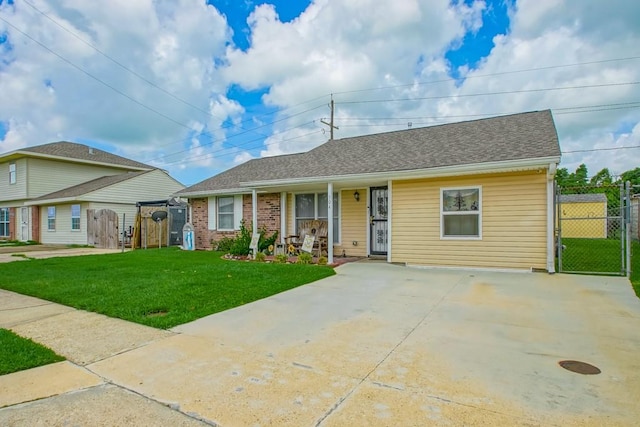 view of front of property with covered porch and a front yard