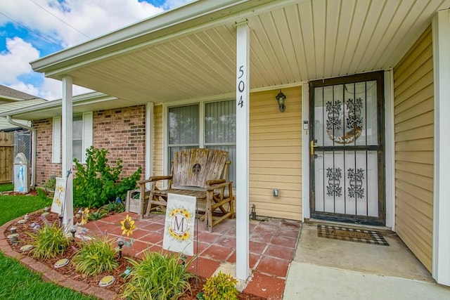 doorway to property with a porch