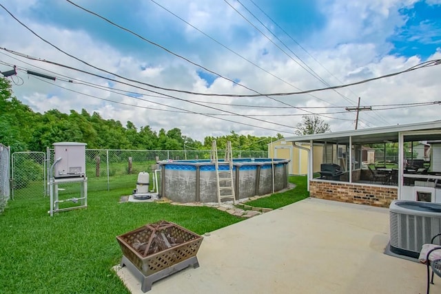 view of patio / terrace with a gate, central AC, fence, a fire pit, and a fenced in pool