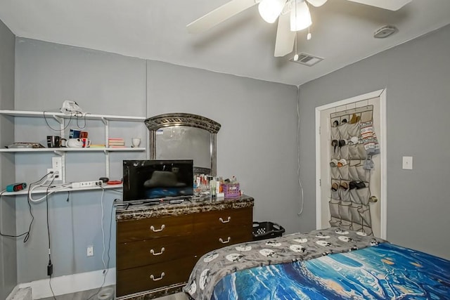 bedroom featuring visible vents and ceiling fan