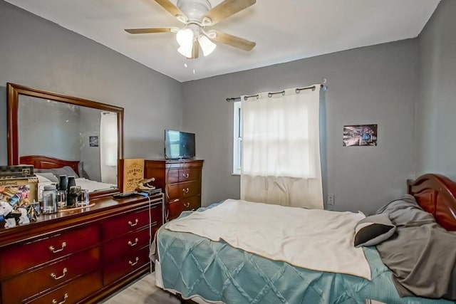 bedroom featuring a ceiling fan and wood finished floors