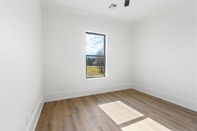 unfurnished room with light hardwood / wood-style floors