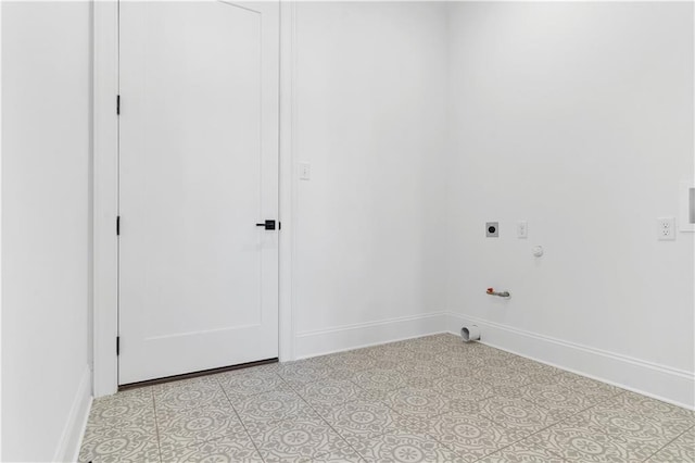 washroom featuring electric dryer hookup, hookup for a gas dryer, and light tile floors