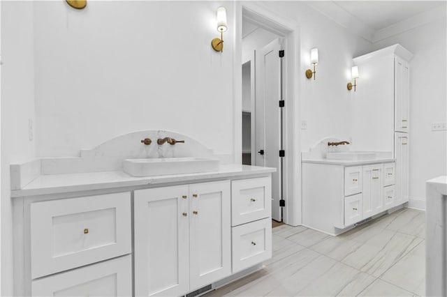 bathroom featuring tile floors, crown molding, and vanity