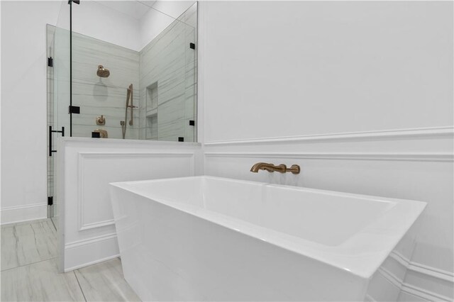 bathroom with tile flooring and plus walk in shower