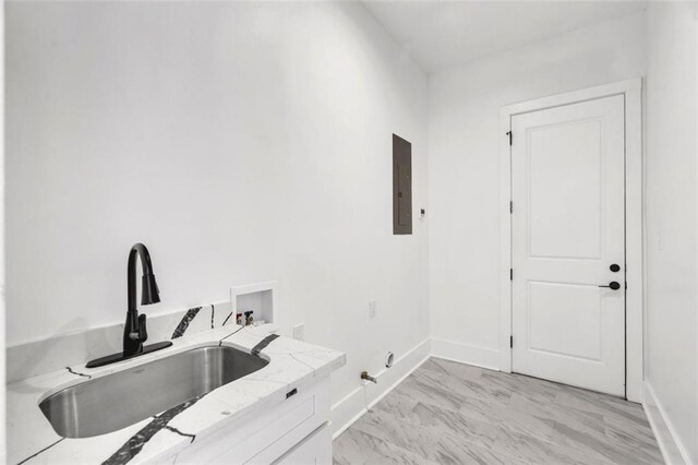 kitchen featuring appliances with stainless steel finishes, decorative light fixtures, sink, white cabinets, and ornamental molding