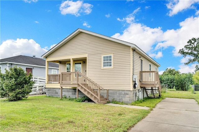 bungalow-style house featuring a front lawn, stairway, and a porch