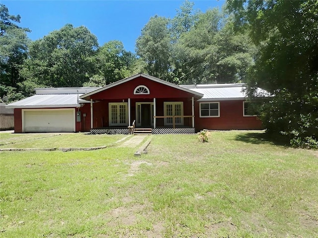 view of front of home featuring a garage and a front lawn