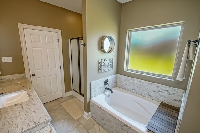 full bath with a bath, a stall shower, vanity, and tile patterned floors