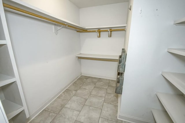 walk in closet featuring light tile patterned floors