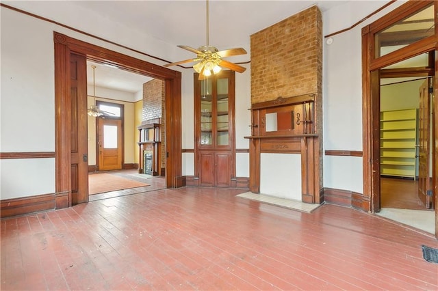 empty room featuring ceiling fan and hardwood / wood-style floors