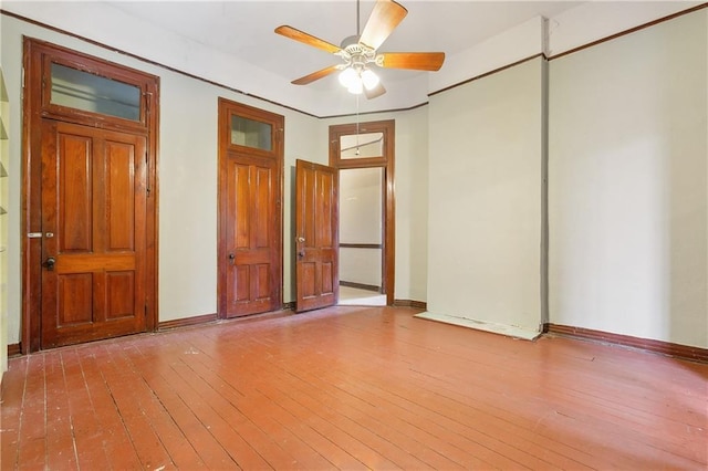 empty room featuring ceiling fan and light hardwood / wood-style floors