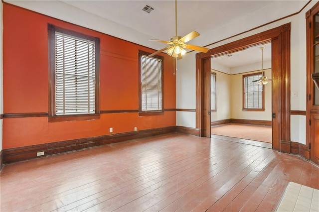 spare room with ceiling fan and hardwood / wood-style floors